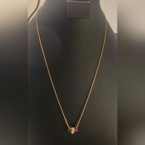 Elegant Gold Necklace with Red and Silver Accents